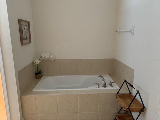 bathroom with tiled bath