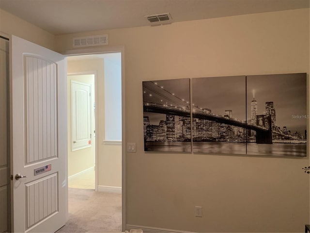 corridor featuring light carpet