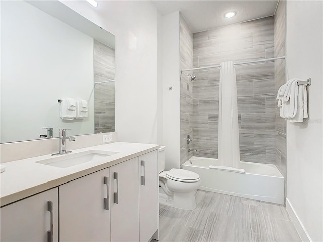 full bathroom with tiled shower / bath, toilet, tile flooring, and vanity