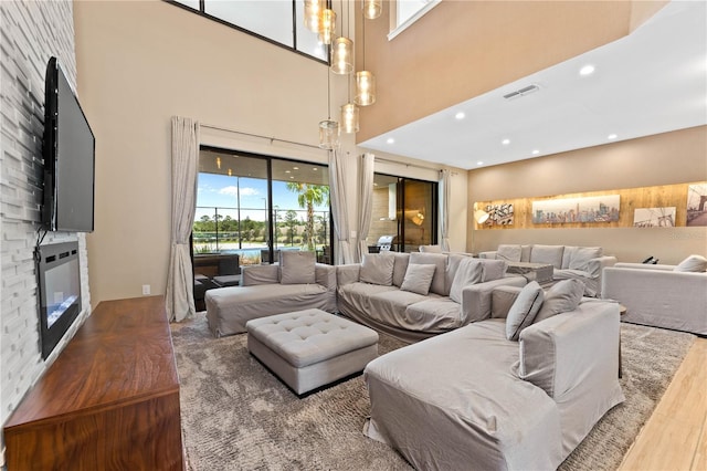 living room featuring hardwood / wood-style floors and a high ceiling