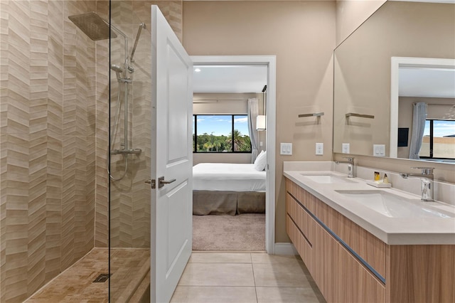 bathroom with plenty of natural light, an enclosed shower, tile floors, and dual bowl vanity