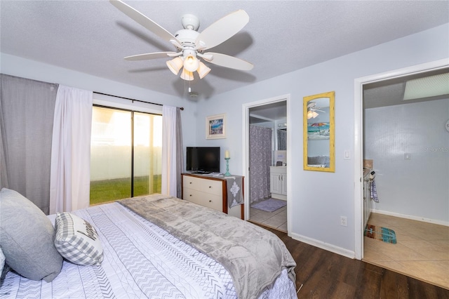 tiled bedroom featuring ensuite bath, ceiling fan, and a textured ceiling