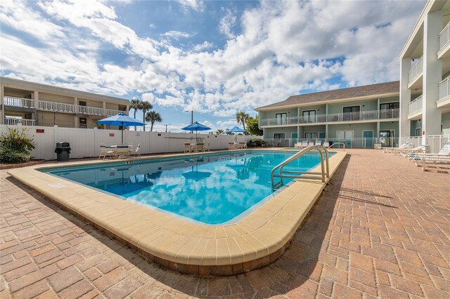 view of pool featuring a patio