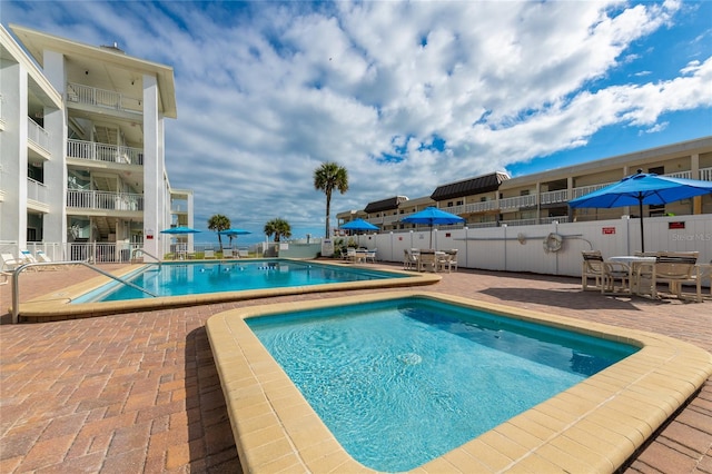 view of pool featuring a patio