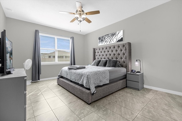 tiled bedroom with ceiling fan