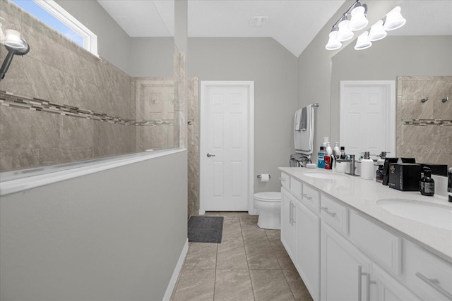 bathroom with oversized vanity, toilet, tile floors, and dual sinks