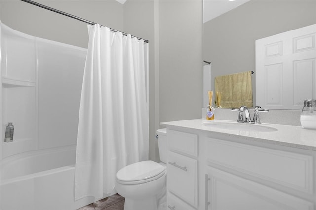 full bathroom featuring vanity, tile floors, shower / bath combo with shower curtain, and toilet