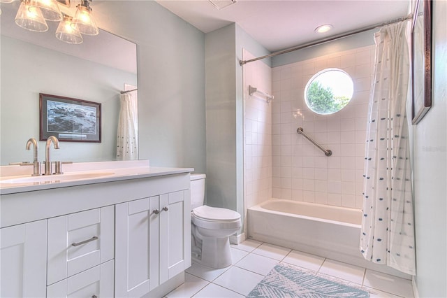 full bathroom featuring toilet, vanity, tile patterned floors, and shower / tub combo with curtain