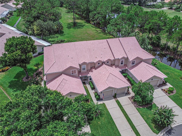 birds eye view of property featuring a water view