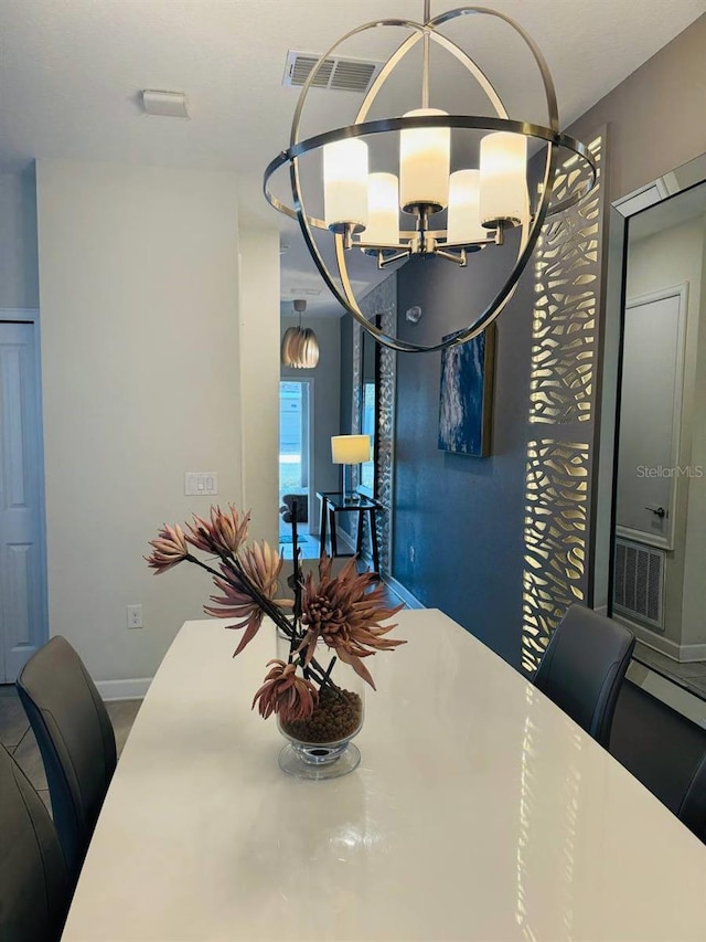 dining area featuring a chandelier