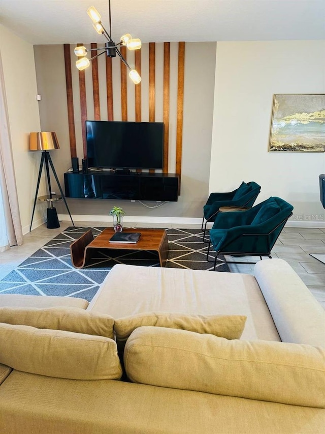 living room featuring a chandelier and light tile flooring