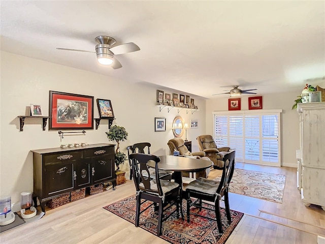 dining room featuring light hardwood / wood-style flooring and ceiling fan