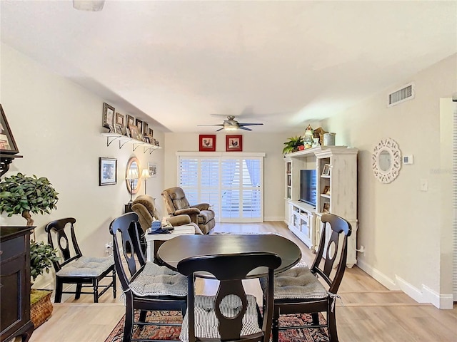 dining area featuring light hardwood / wood-style flooring and ceiling fan