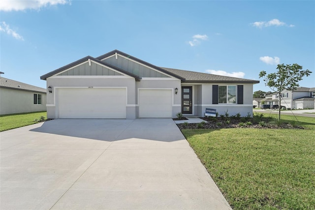 single story home featuring a front lawn and a garage