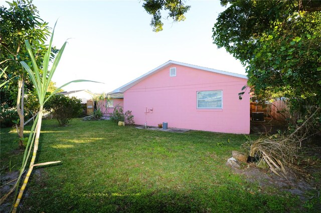 595 Benjamin Franklin Pl, Orlando, FL 32809 - view of yard featuring central AC unit