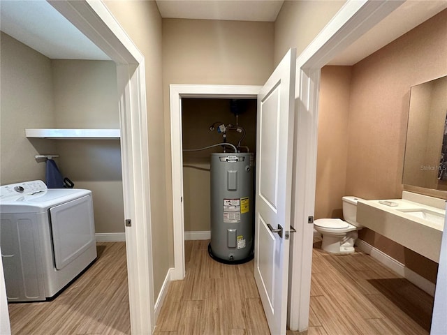 laundry area featuring water heater and washer / clothes dryer