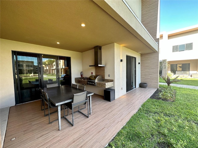 deck with area for grilling, grilling area, and a lawn