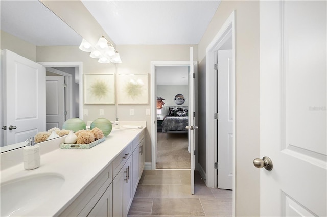 bathroom with dual sinks, tile floors, and oversized vanity