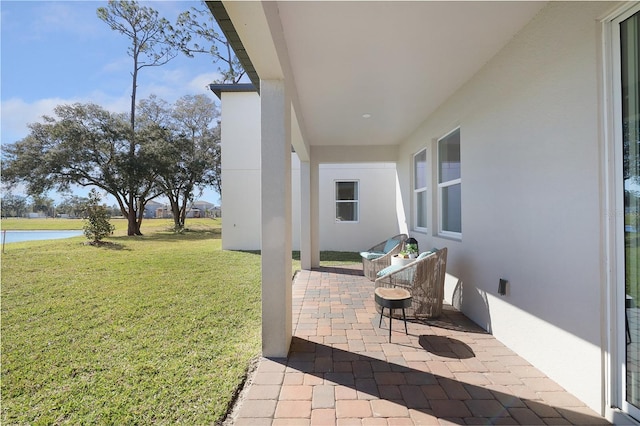 view of patio / terrace with a water view