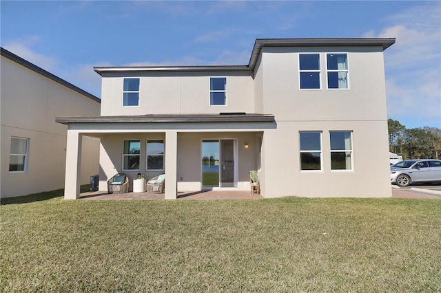 rear view of house with a yard