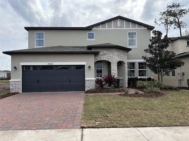 view of front facade featuring a front yard and a garage