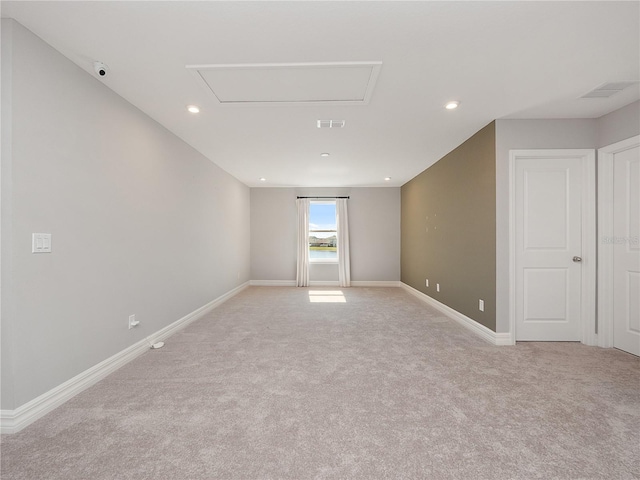 empty room featuring light carpet