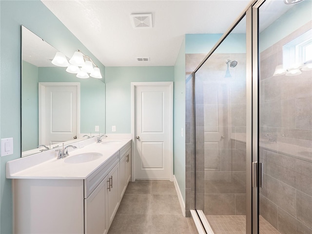 bathroom featuring tile floors, vanity with extensive cabinet space, double sink, and walk in shower