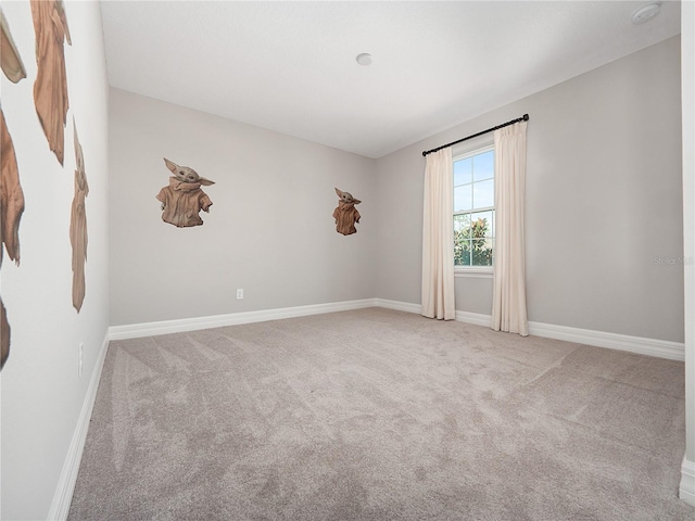 empty room featuring light colored carpet