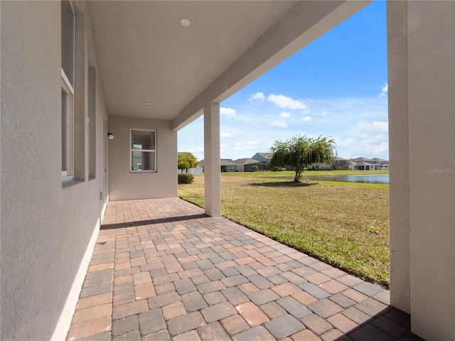 view of patio / terrace with a water view