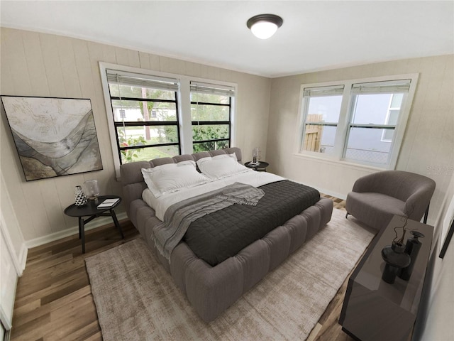 bedroom with hardwood / wood-style floors