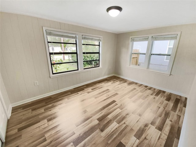 unfurnished room with light hardwood / wood-style floors