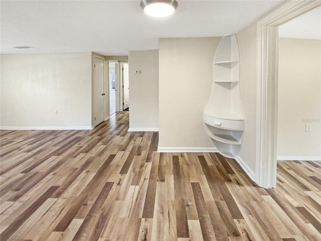 unfurnished room featuring hardwood / wood-style flooring