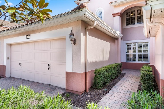 view of side of home featuring a garage