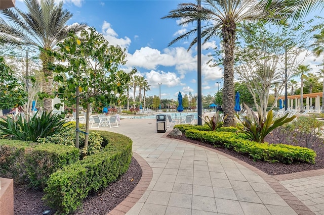 view of home's community featuring a swimming pool and a patio area