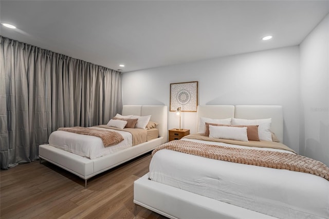 bedroom featuring wood-type flooring