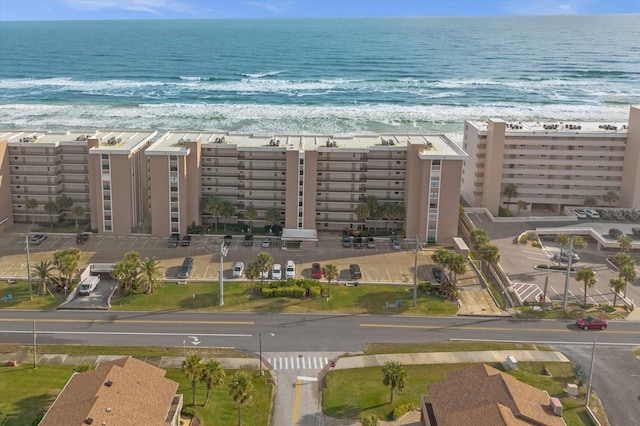 birds eye view of property featuring a view of the beach and a water view