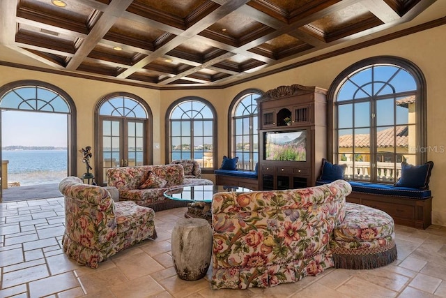 tiled living room featuring coffered ceiling, a water view, beamed ceiling, and crown molding