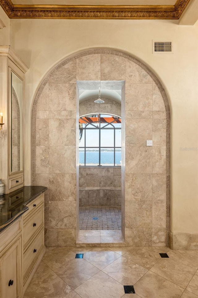 bathroom featuring tile walls, tile floors, and vanity