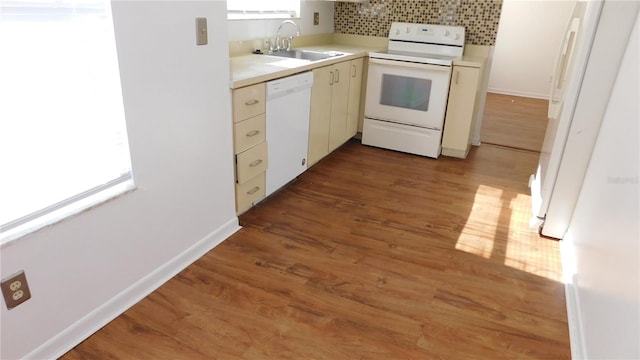 kitchen with backsplash, dark wood-type flooring, white appliances, and sink