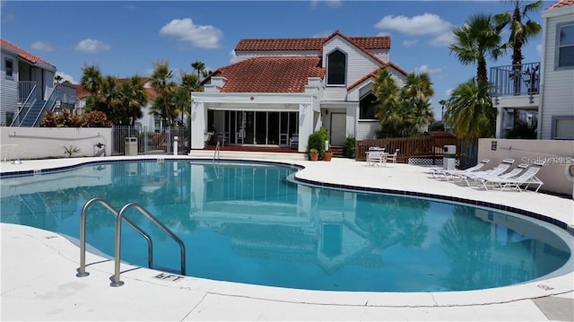 view of swimming pool with a patio area