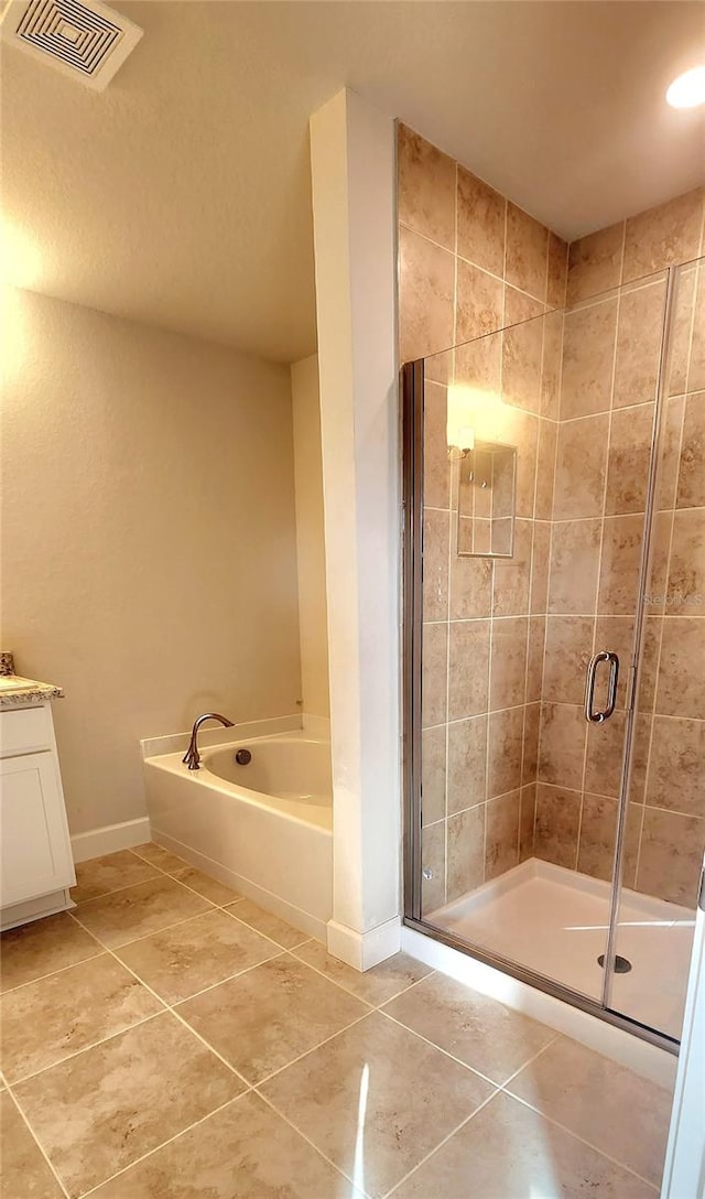 bathroom with vanity, independent shower and bath, and tile patterned flooring