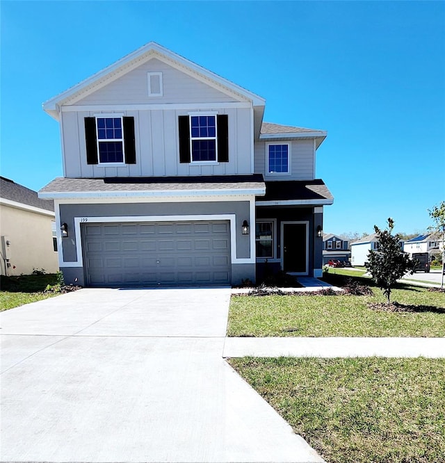 view of front facade with a garage and a front yard