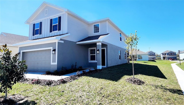 view of front of home with a garage and a front yard