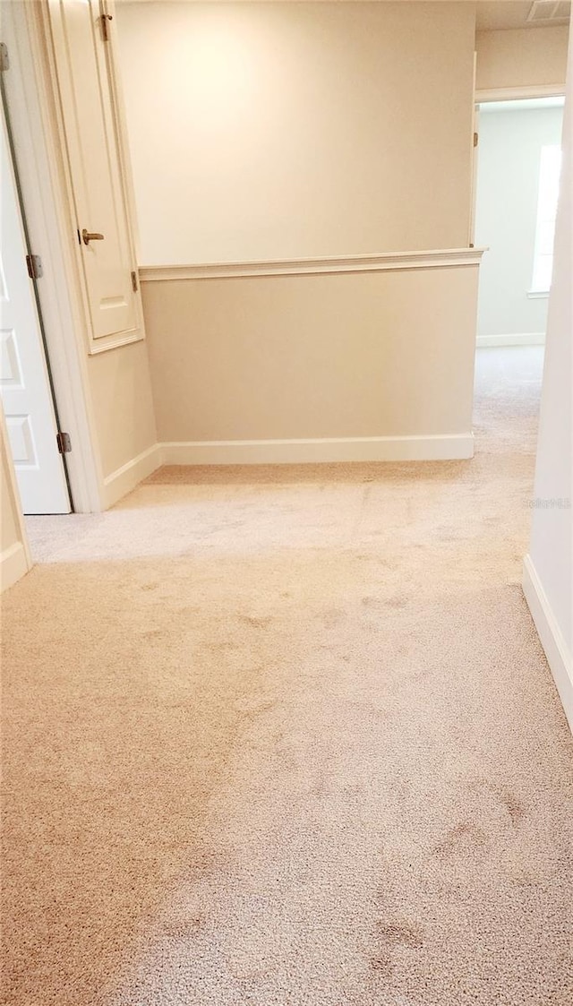 empty room featuring light colored carpet