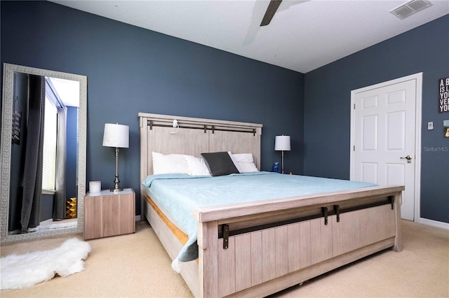 carpeted bedroom with ceiling fan