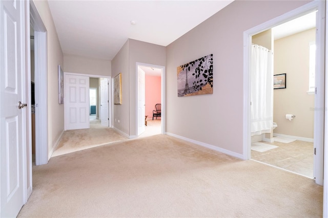 hallway with light tile floors