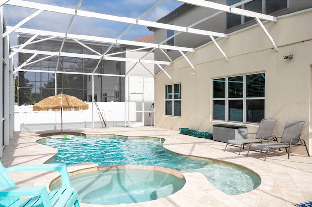 view of pool with a patio area and a lanai