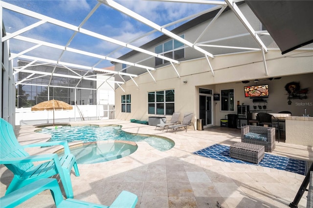 view of swimming pool featuring a lanai and a patio area