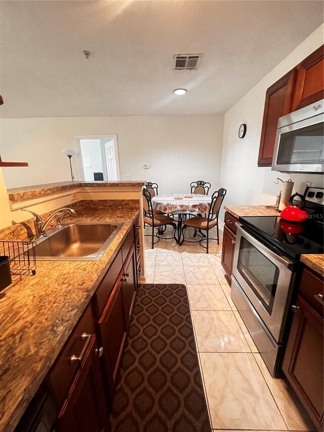 kitchen featuring a sink, visible vents, and appliances with stainless steel finishes