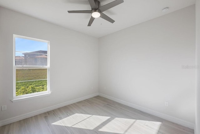 spare room with ceiling fan and light hardwood / wood-style floors